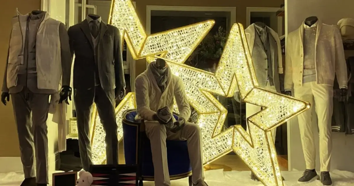 Storefront fashion display with illuminated star lights.